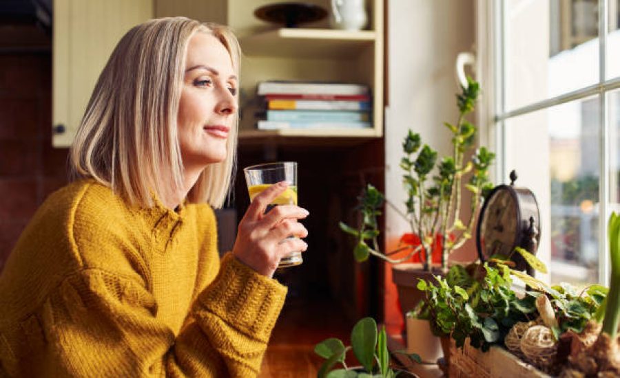 mature woman drinking glass of water