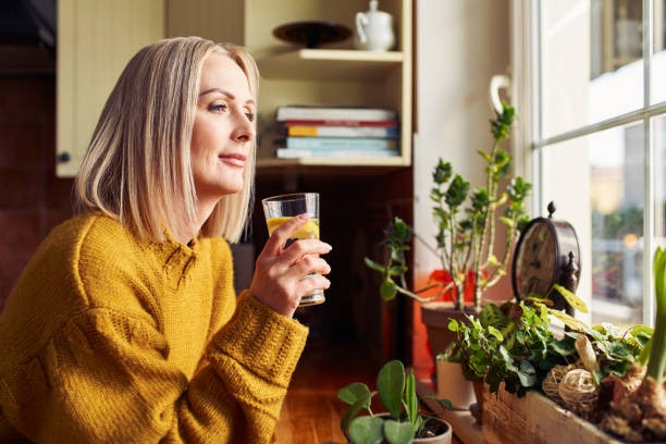 mature woman drinking glass of water